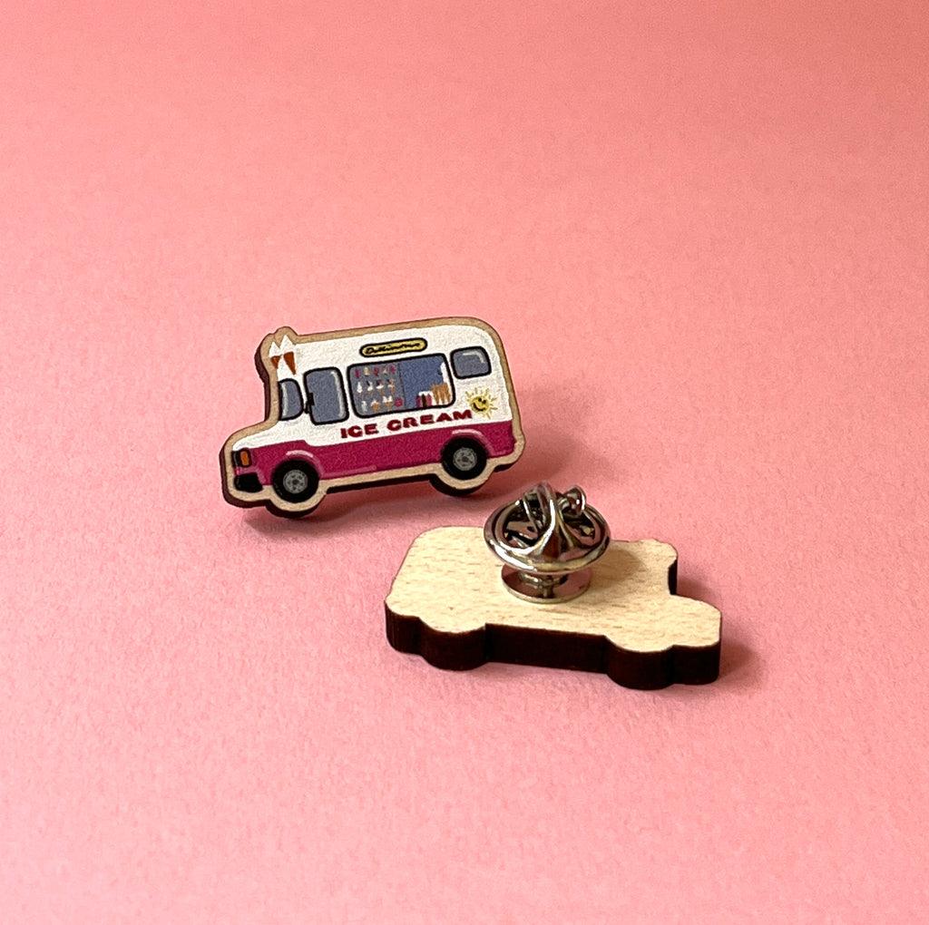 Ice cream truck pin on a pink background