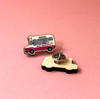 Ice cream truck pin on a pink background