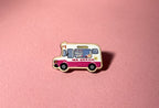 Pin of an ice cream truck on a pink background