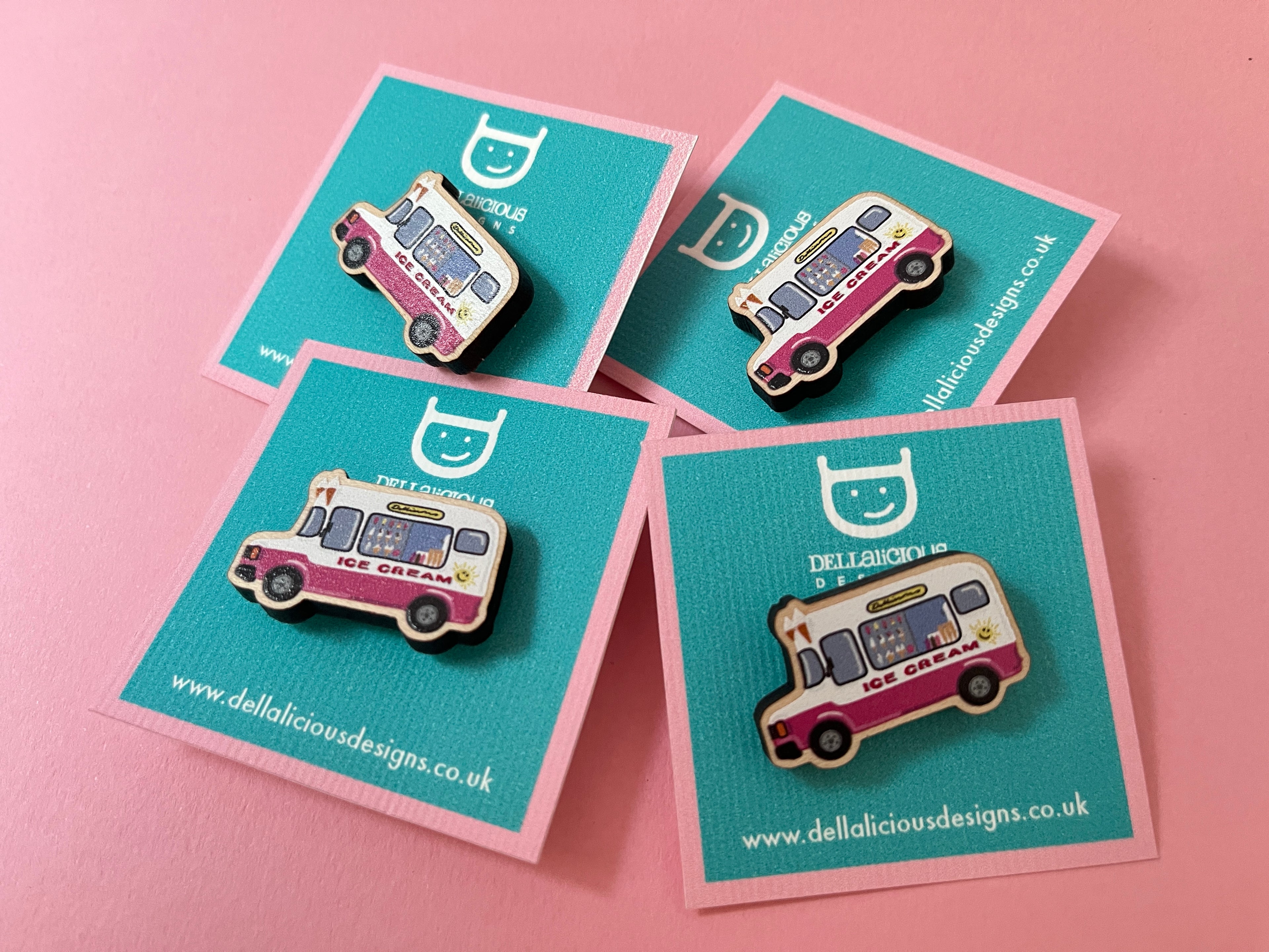 Four ice cream van pins on blue cards with a pink background