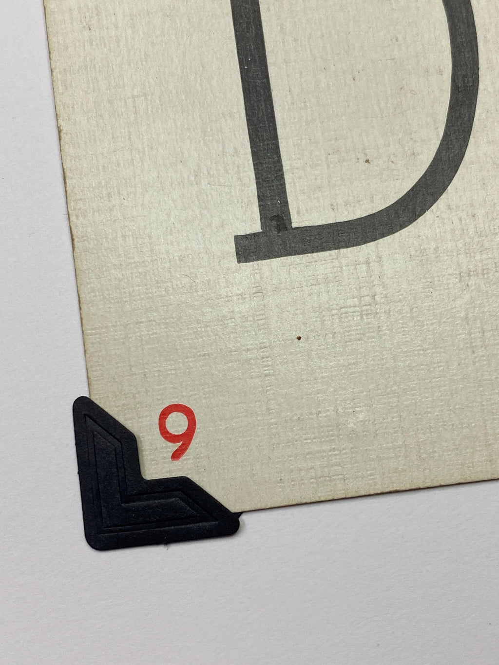 A black corner photo mount